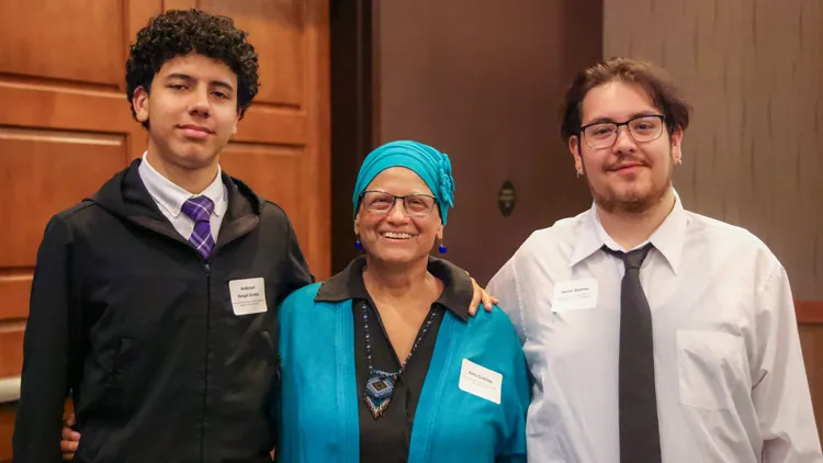 Support SVC Foundation Three people standing together at the scholarship event