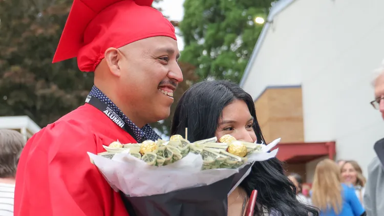 Support SVC Foundation and graduates like this man with bouquet